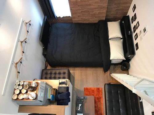 an overhead view of a room with a bed and a desk at Shinagawa New Apt Easy access to both Haneda & Narita Airport in Tokyo
