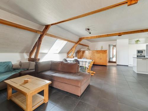 a living room with a couch and a table at In de Wollekjes in Merksplas