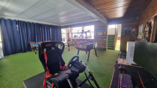 a room with a camera and a desk with a table at Villa Des Remparts in Sainte-Marie