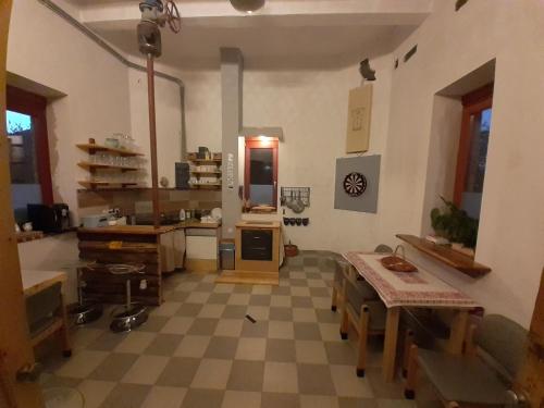 a large kitchen with a checkered floor at ToronySzoba in Szob
