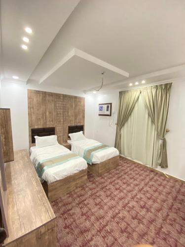 Katil atau katil-katil dalam bilik di الألماسة للشقق الفندقيه