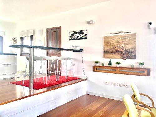 a living room with a glass table in the middle at Casa Estela in Villaverde