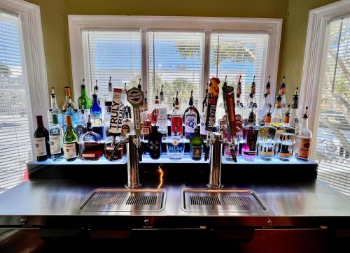 a bar with a lot of bottles of alcohol at Key West Villas in Key West
