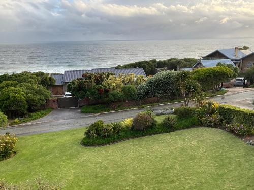 an aerial view of a yard with the ocean in the background at Bloudam Wilderness in Wilderness