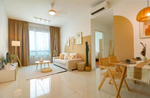 a living room with a couch and a table at Greenfield Residence At Sunway City by Nexx Field in Petaling Jaya