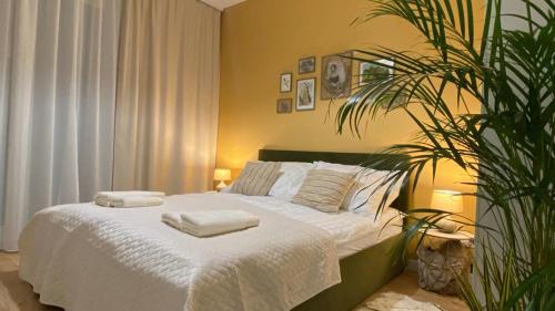 Ένα ή περισσότερα κρεβάτια σε δωμάτιο στο Green Park Apartament