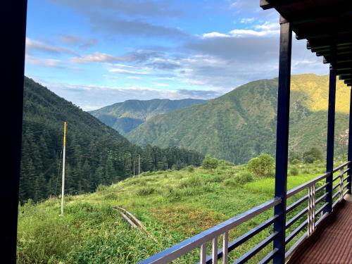 a view from a train window of a mountain valley at Shoonya Home Stay - Devalsari Deodar Forest Range - 60min from Mussoorie in Mussoorie