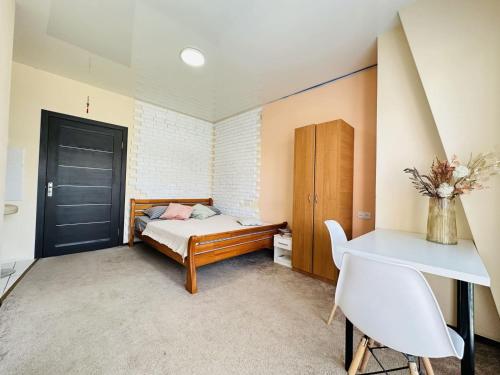 Ένα ή περισσότερα κρεβάτια σε δωμάτιο στο Apartments on the embankment