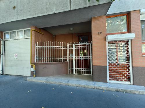 a building with a gate in front of a building at OASIS APARTMAN in Szeged