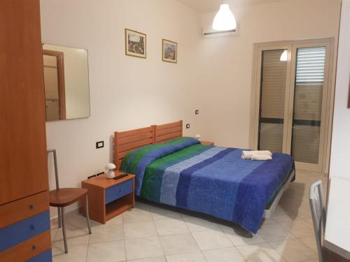 Postel nebo postele na pokoji v ubytování Casa Vacanza, Ristorante Borgorosso