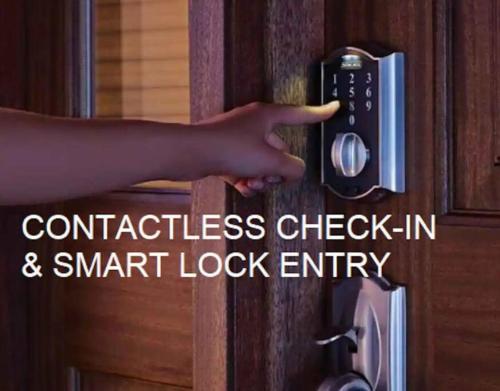 a persons hand reaching for a door lock entity at Luxury Style 2 King Bed WD FREE Garage in Schenectady