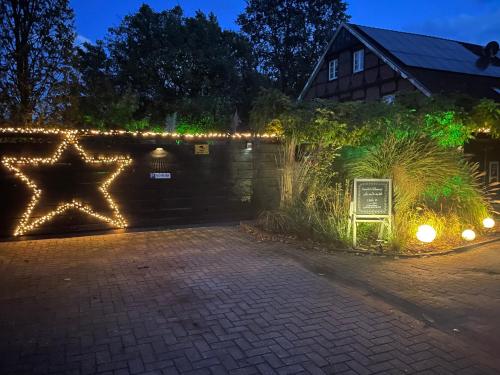 a garden with christmas lights on a fence at Weberhof - Münster 3 in Münster