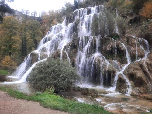 a waterfall on the side of a mountain at GITE CHEZ MONETTE in Nance