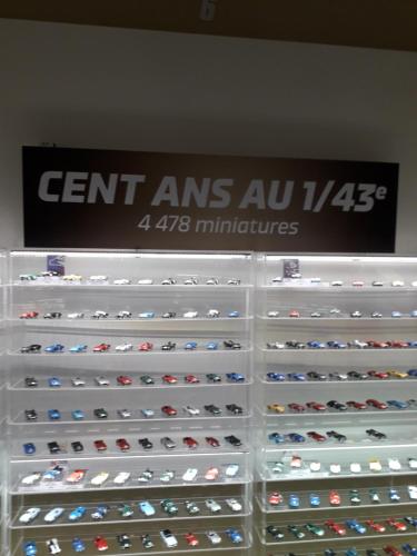a display case filled with lots of toy cars at Proximite circuit 24 heures in Le Mans