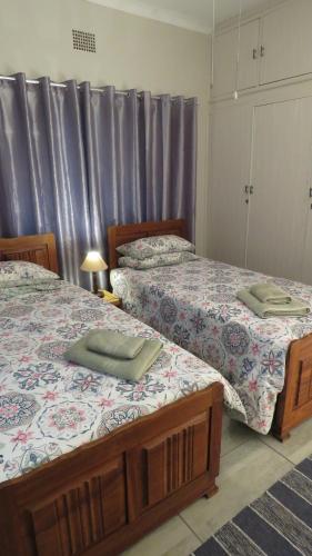 Postel nebo postele na pokoji v ubytování Parksig Self Catering
