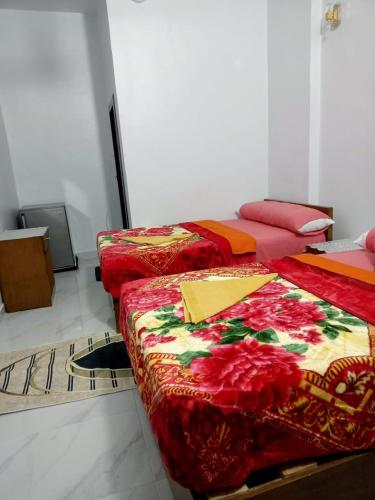Katil atau katil-katil dalam bilik di Onaty Narty Guest house