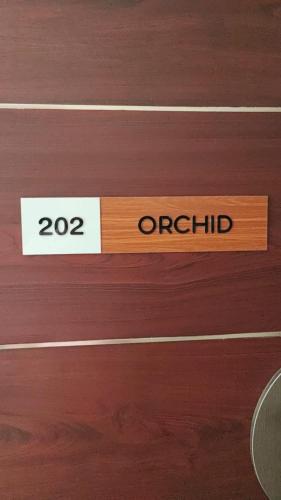 a wooden door with a sign that reads orfield at Magni Home in Cochin