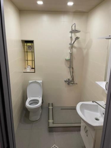 a bathroom with a toilet and a sink at Garden Hotel Pasanauri since 1892 in Passanauri