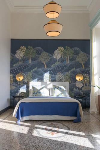 a bedroom with a bed with a painting of trees at LAVI' SUITE elegante centrale luminoso in Turin