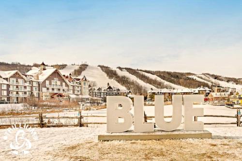 a sign that says bilo in front of a village at Blue Mountain, Collingwood - Loft Condo, sleeps 4 in Blue Mountains