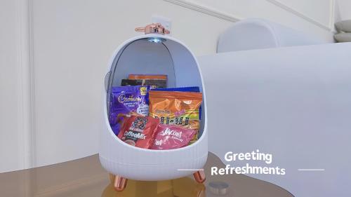 a refrigerator filled with chips and other snacks at SkyPool with Seaview 8pax Beacon Executive Suites - Georgetown City Centre - 3km to Komtar in George Town
