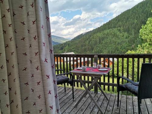 a patio with a table and chairs on a deck at PAAL 162 - Tolle Aussicht, 2 Terasssen, Großes Grundstück in Stadl an der Mur