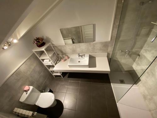 a bathroom with a sink and a mirror at La Cantonada II in Bourg-Madame