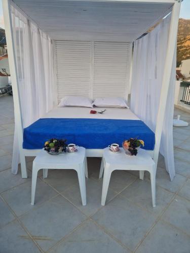 a bedroom with a bed and two tables at Apartments Tamara in Budva