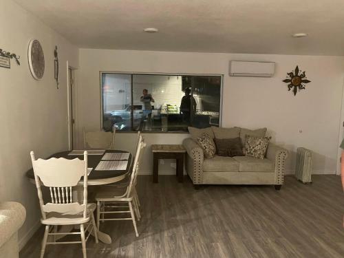 a living room with a couch and a table at Crazy Horse - APT 1 in Kanab