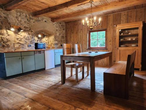 a kitchen with a table and chairs in a room at Urlaub in der Burg am Bodensee in Kressbronn am Bodensee