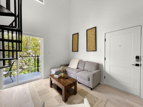 a living room with a couch and a table at Mary's Stay Brookland in Washington