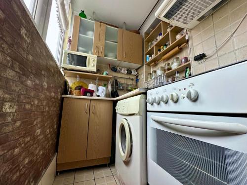 Η κουζίνα ή μικρή κουζίνα στο Apartman Sunce