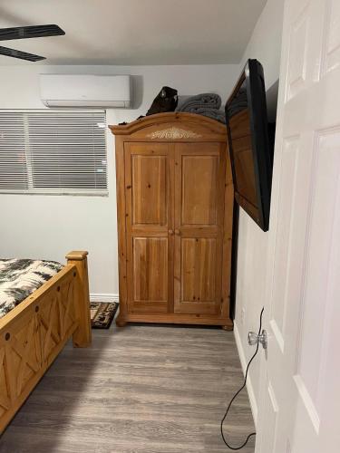 a bedroom with a bed and a tv in a room at Crazy Horse - APT 1 in Kanab