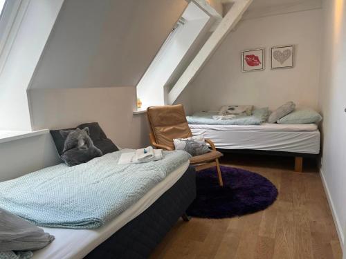 Кровать или кровати в номере Skovridergaardens Ferielejligheder