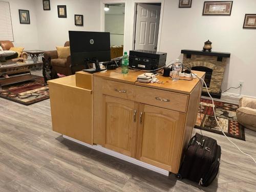 a living room with a desk with a computer on it at Crazy Horse - APT 1 in Kanab