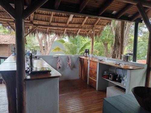 an outdoor kitchen with a counter and a counter top at Quinta Esencia in Brasilito