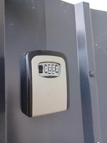 a close up of a metal door with a key pad at Aquas AP in Petrijanec