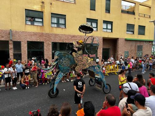 a crowd of people watching a float in a parade at Duplex El Principito in Gran Tarajal