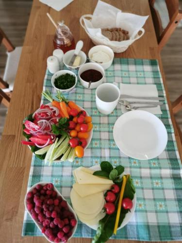 a table with a bunch of different types of fruits and vegetables at Dom w Siedlisku pod Orzechem in Przyłęk