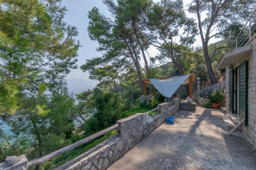 a house with a view of the ocean at Holiday home Masha in Bogomolje