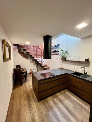 a kitchen with a sink and a counter top at Loftový apartmán Laura in Světlá nad Sázavou