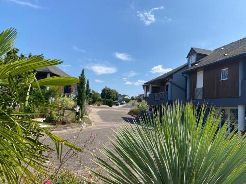 a street in a village with houses and plants at Residence Croma in La Roche-Posay