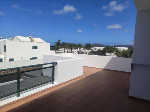 a view from the balcony of a white building at Casa Gara in Yaiza