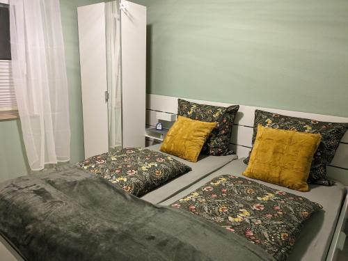 a bedroom with two pillows and a bed in it at Ferienwohnung Dr. Vera Schmidt in Kreischa