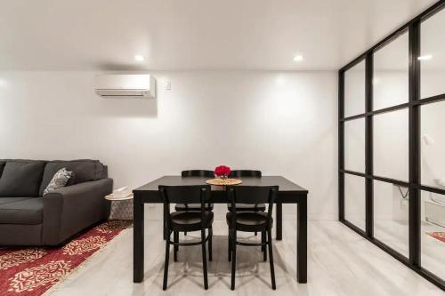 a dining room with a table and chairs and a couch at Central Location Brooklyn Stay at Rem-Casa in Brooklyn