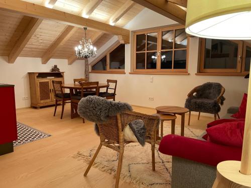 a living room with a couch and a table at Landlust Ischl in Bad Ischl