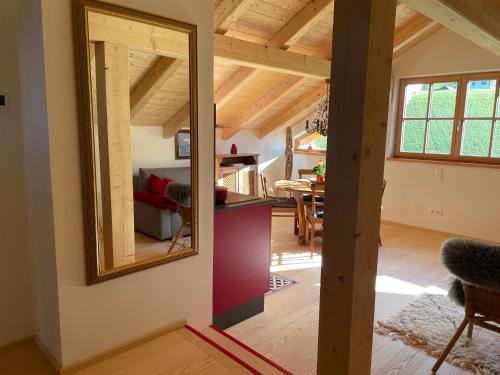 a mirror on the wall of a room with a dining room at Landlust Ischl in Bad Ischl