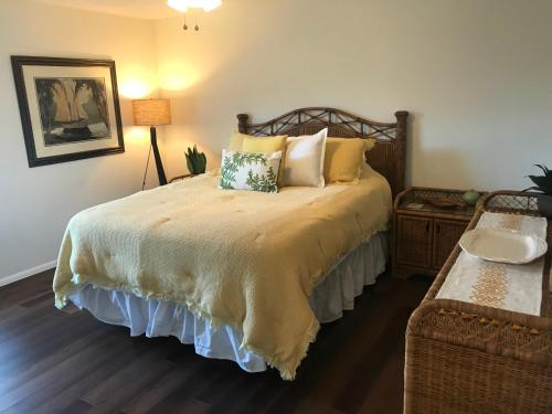 a bedroom with a large bed with pillows at Cypress Retreat in Fort Myers