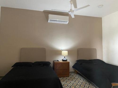 Katil atau katil-katil dalam bilik di Bungalows Punta conejo