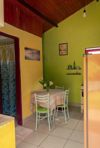 a dining room with a table and chairs at Chalés Um Sonho a Mais in São Bento do Sapucaí